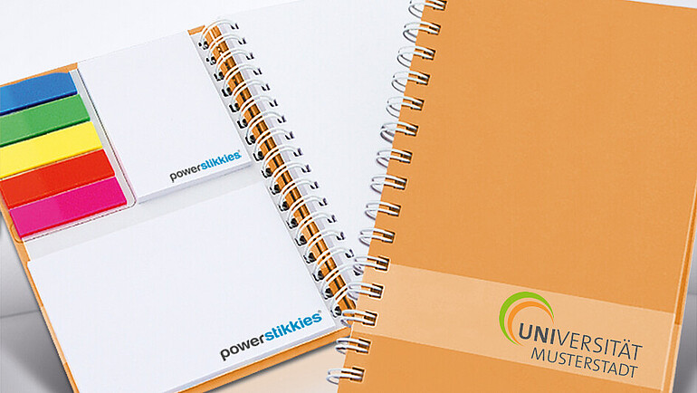 Book with white paper and various paper adhesive markers