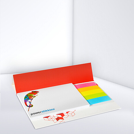 White adhesive note pad with five multi-coloured paper markers on cardboard