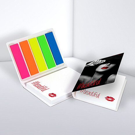 White adhesive note pad with five multi-coloured plastic markers in printed cardboard cover