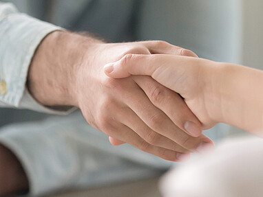 Man and woman shake hands