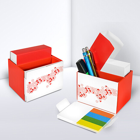 Printed cardboard box with space for office utensils, sheets, adhesive notes and marker set