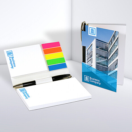 Two white adhesive note pads with five multi-coloured plastic markers and ballpoint pen in printed cardboard cover