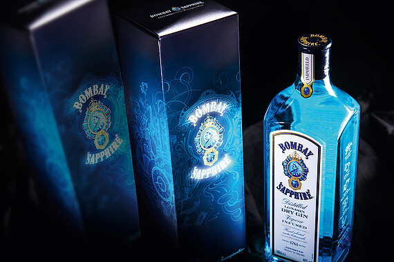 Blue illuminated folding box with gin bottle