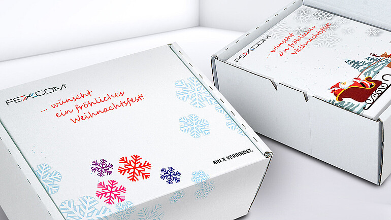 Outer packaging for FEXCOM made of white, printed cardboard