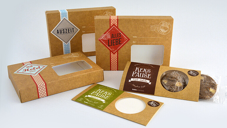 A variety of cardboard biscuit packaging with window