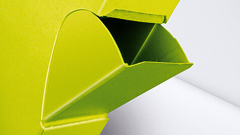 Yellow folding box with pouring opening as a close-up